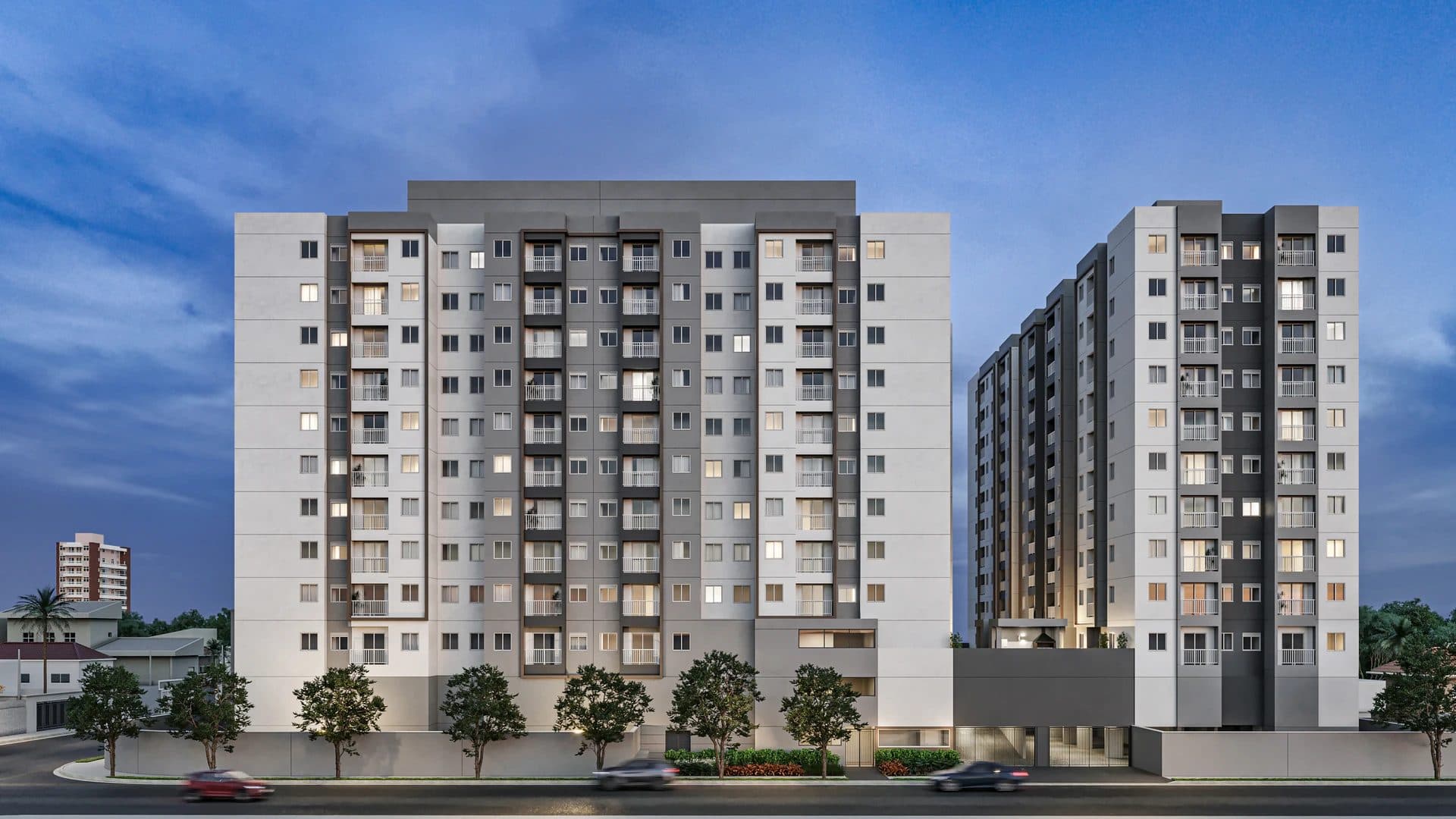 Fachada do edifício residencial com varandas e térreo arborizado.